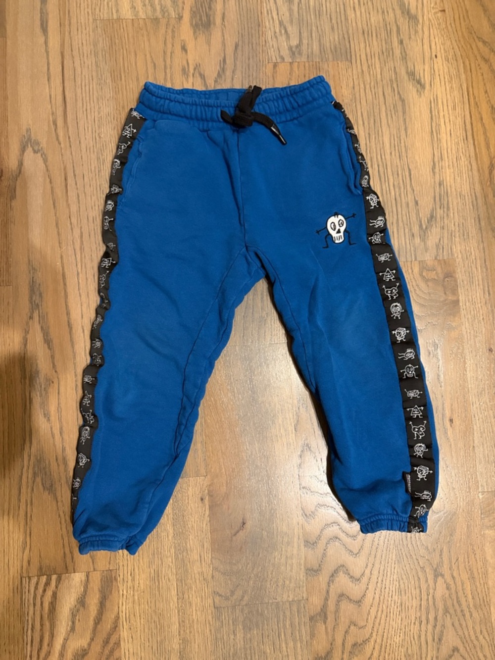 nununu Royal Blue Joggers with Skull Trim